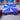 Rainbow metallic purple hard-shell vial storage case opened to display organized rows of 3mL vials in a compact high-capacity layout with color-shifting finish reflecting purple, blue, and pink ton
