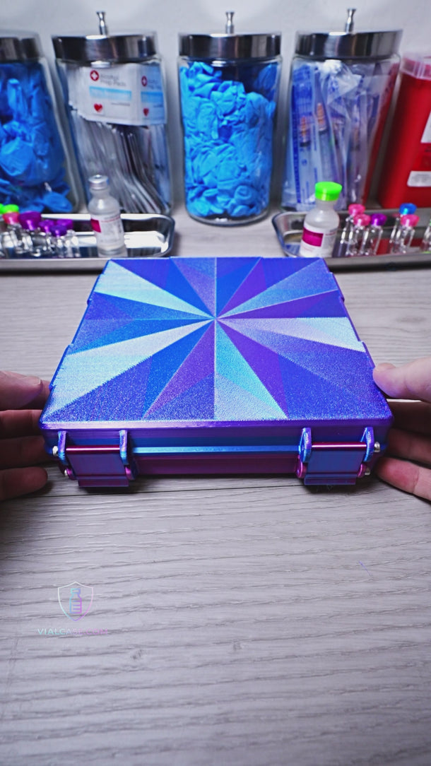 Rainbow metallic purple hard-shell vial storage case opened to display organized rows of 3mL vials in a compact high-capacity layout with color-shifting finish reflecting purple, blue, and pink ton