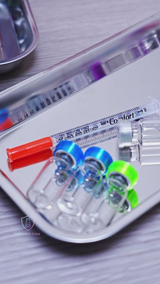 Large hard-shell case opened to show organized rows of small and medium vials along with a compartment holding syringes and prep pads.