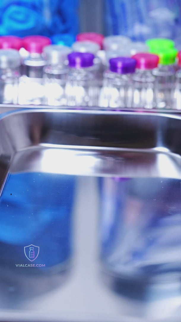 Clear vial sleeves being placed over vials with flexible caps added on top, showing protection against impact and secure fit for storage and travel.